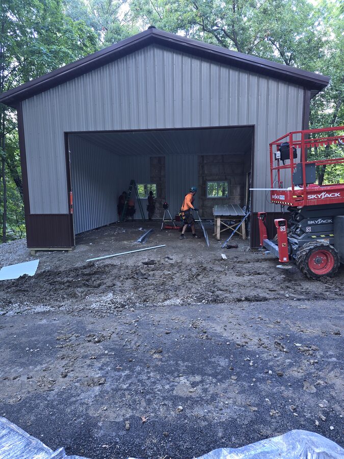 Post frame garage construction progress on wooded lot in Marseilles Illinois