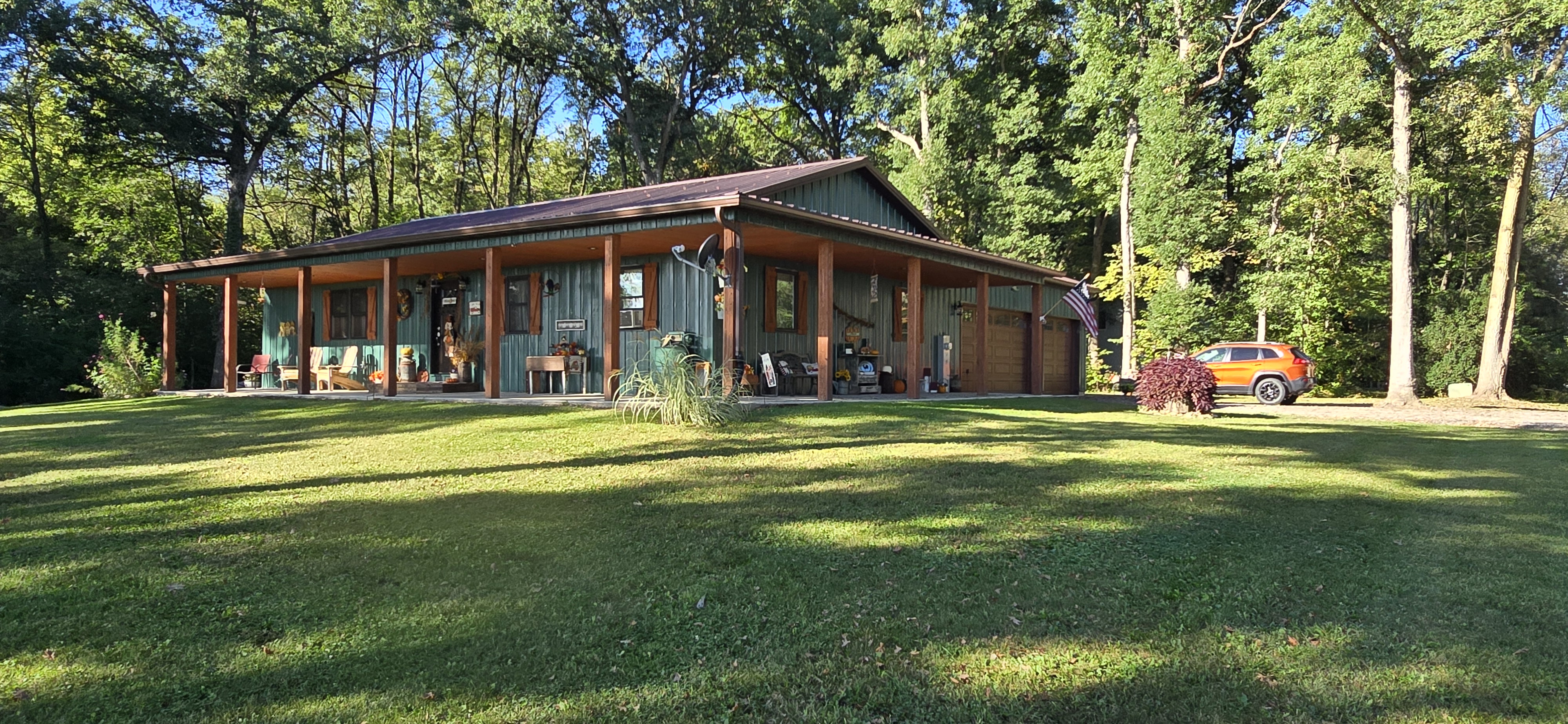 Serena Illinois attached garage barndominium construction with engineered post frame shell
